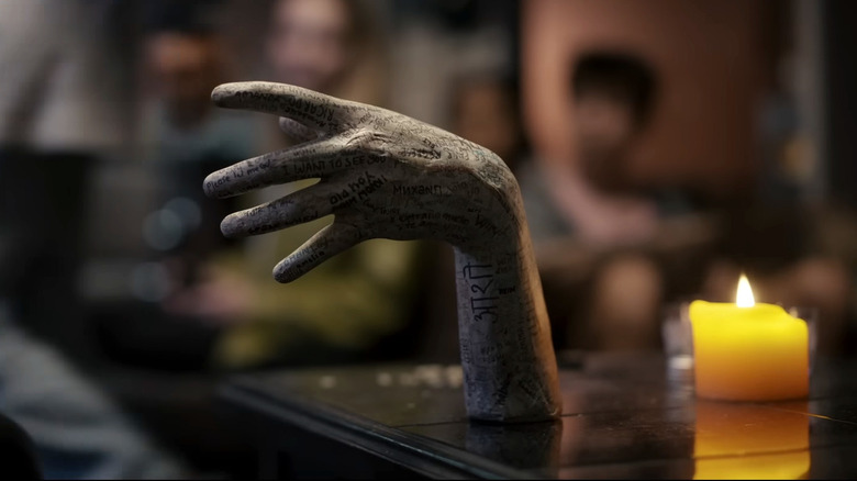 The severed hand on the table in Talk to Me