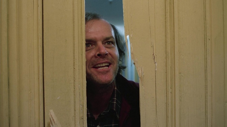Jack Nicholson's Jack Torrance peeking through the door in The Shining