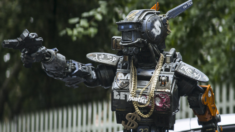 Chappie pointing a gun