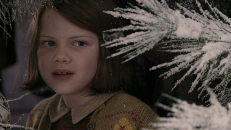 Lucy (Georgie Henley) entering Narnia in The Lion, The Witch, and The Wardrobe