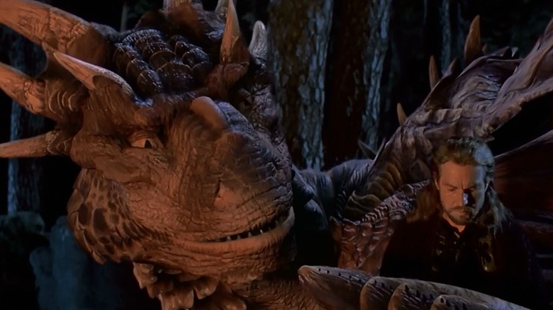 Draco (Sean Connery) looking at Sir Bowen (Dennis Quaid) in Dragonheart