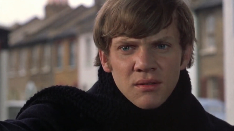 Mick (Malcolm McDowell) frowning in if....