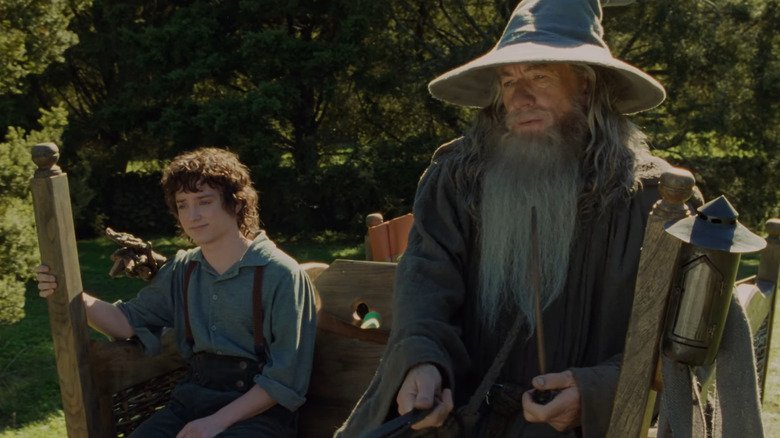 Frodo (Elijah Wood) and Gandalf (Ian McKellan) on cart in Fellowship of the Ring