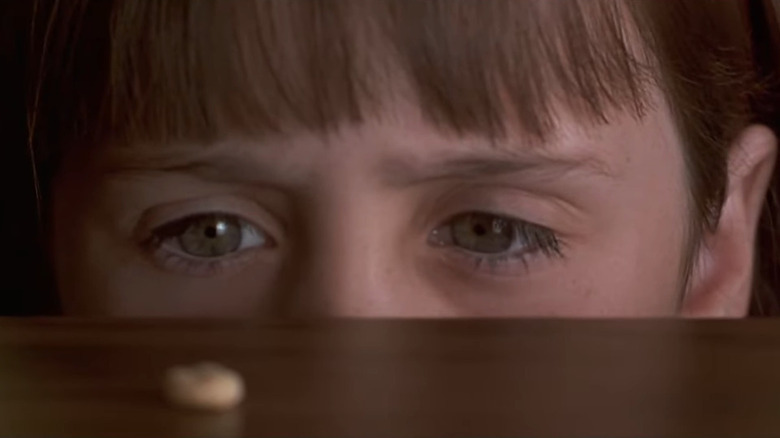 Matilda (Mara Wilson) moves a Cheerio with her mind in Matilda