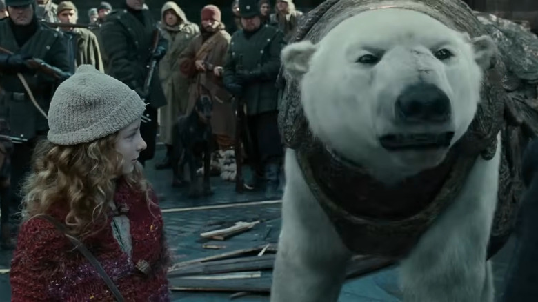 Lyra (Dakota Blue Richards) and polar bear in The Golden Compass