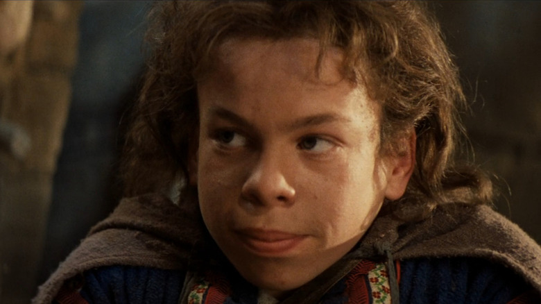 Willow (Warwick Davis) looking serious in Willow