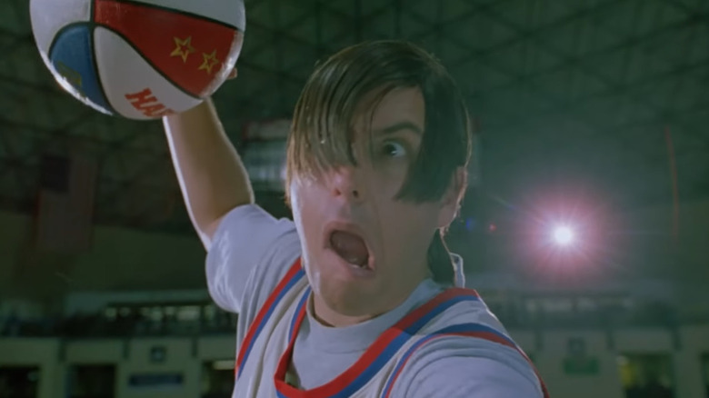 Adam Sandler as Nicky flying through the air and dunking a basketball in Little Nicky