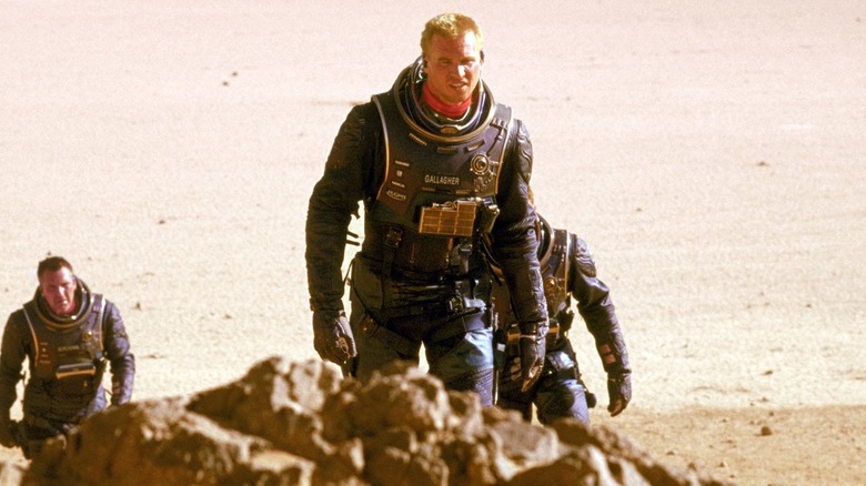 Val Killer as Gallagher cresting a hill on Mars in Red Planet