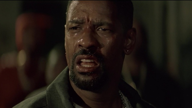 Denzel Washington's Detective Alonzo Harris looks panicked as he sweats in closeup in Training Day