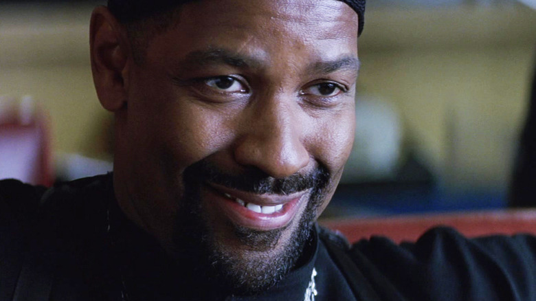 Denzel Washington's Detective Alonzo Harris smiles in closeup in Training Day