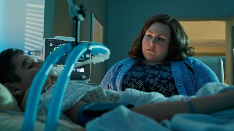 Joyce Smith looking at a boy in a hospital bed in Breakthrough