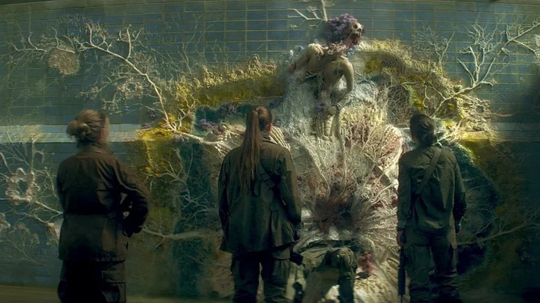 Scientists examine the remains of a soldier trapped in the Shimmer in Annihilation