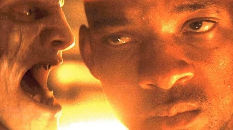 Will Smith as Robert Neville calmly endures a vampire/zombie baring its teeth inches away in I Am Legend