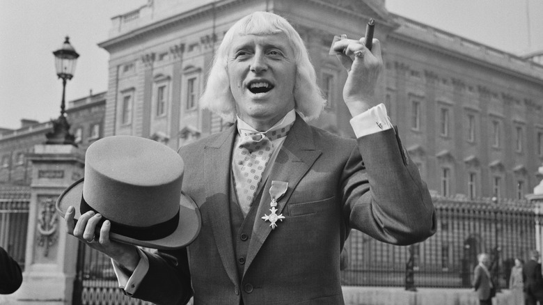 Jimmy Savil is outside the Buckingham Palace
