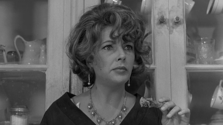 Elizabeth Taylor as Martha holding a chicken wing in Who's Afraid of Virginia Woolf?