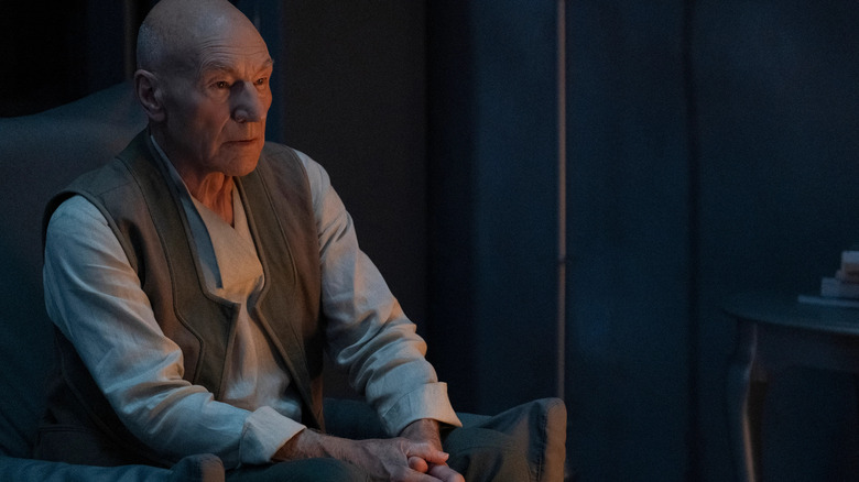 Sir Patrick Stewart seated in Star Trek: Picard