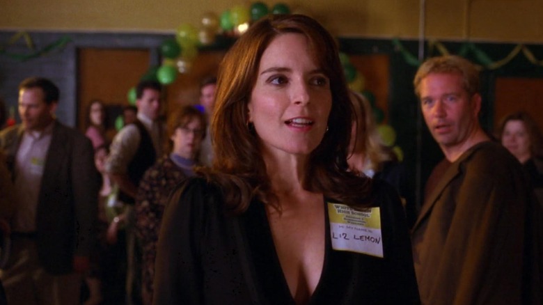 Liz wearing a name tag at her college reunion on 30 Rock