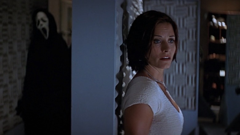 Ghostface stalks seasoned reporter Gale Weathers (Courteney Cox) in Scream 2