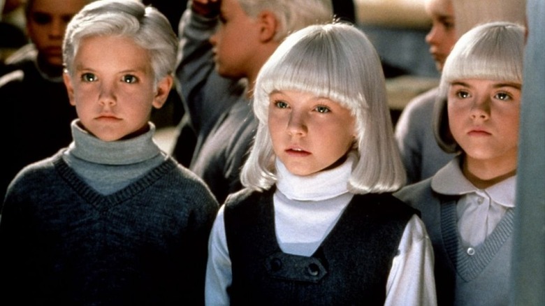 Mara, David and the rest of the children gathered together in Village of the Damned (1995)