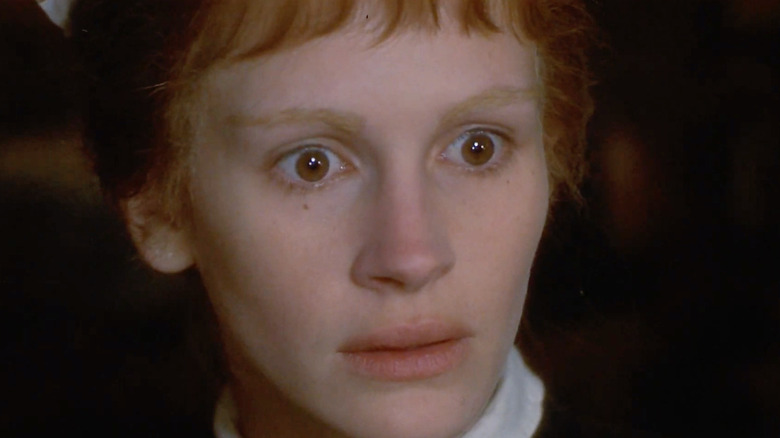 Julia Roberts looks spooked in a maid's outfit as Mary in Mary Reilly