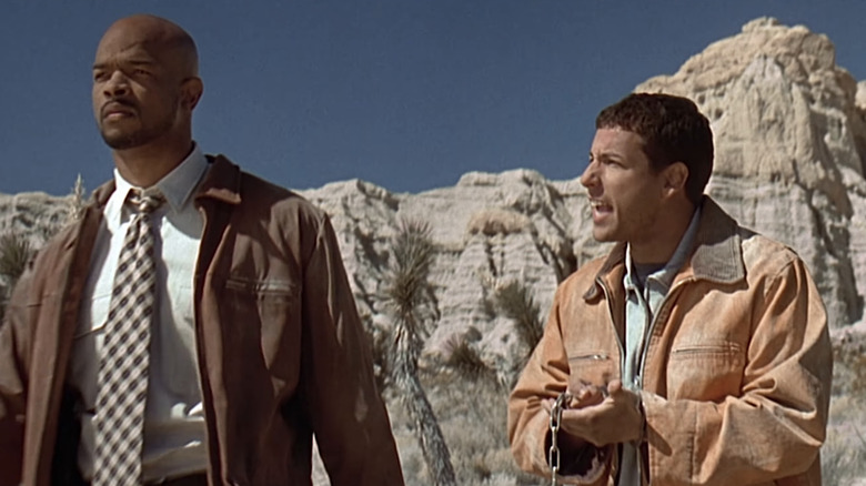 Damon Wayans' Detective Jack Carter stands next to Adam Sandler's Archie Moses in the desert in Bulletproof