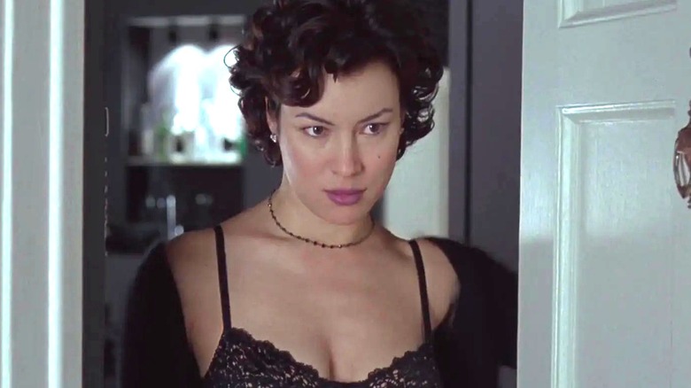 Violet answering the door in Bound