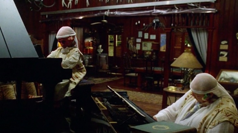 Marlon Brando as Dr. Moreau and Nelson de la Rosa as Majai make sweet music in The Island of Dr. Moreau