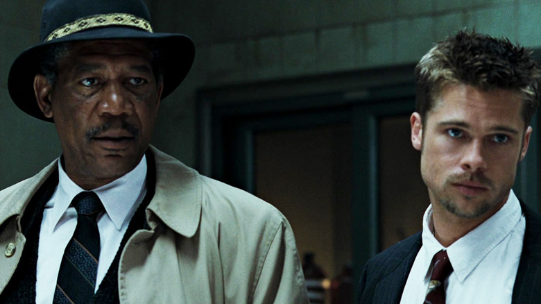 Morgan Freeman's William Somerset stands next to Brad Pitt's David Mills in Seven