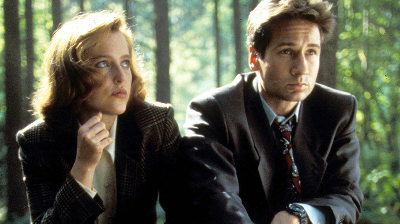 Scully and Mulder in the woods in The X-Files