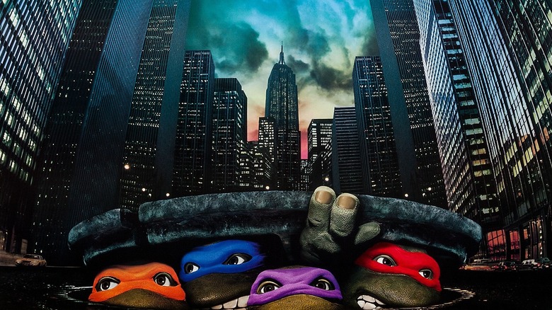 The Turtles emerging from the sewer on the poster for Teenage Mutant Ninja Turtles (1990)