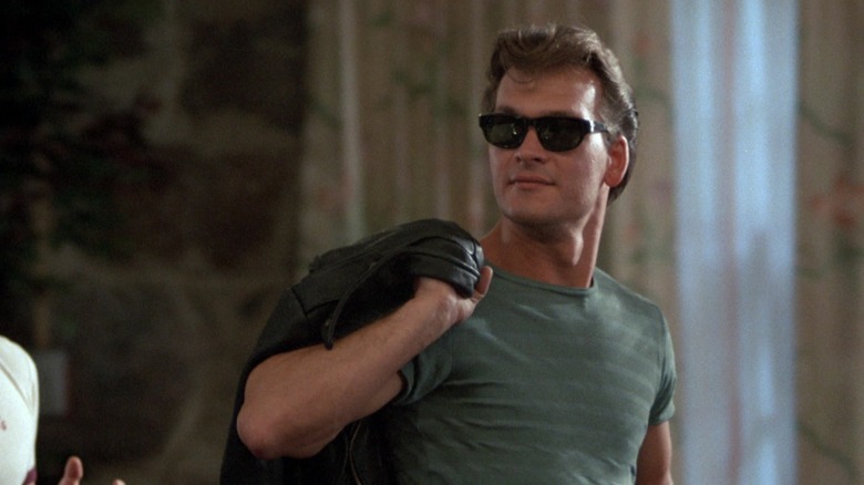 Johnny Castle wearing shades and holding a jacket in Dirty Dancing