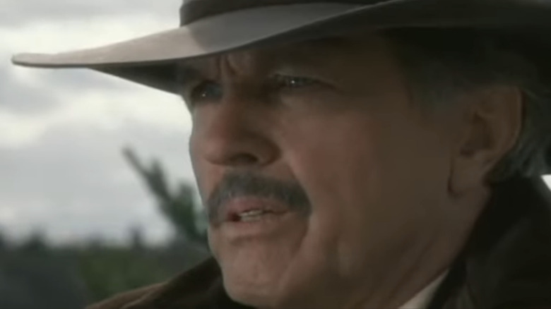 Tom Skerritt's Will Kane is seen in closeup against a clear sky in High Noon