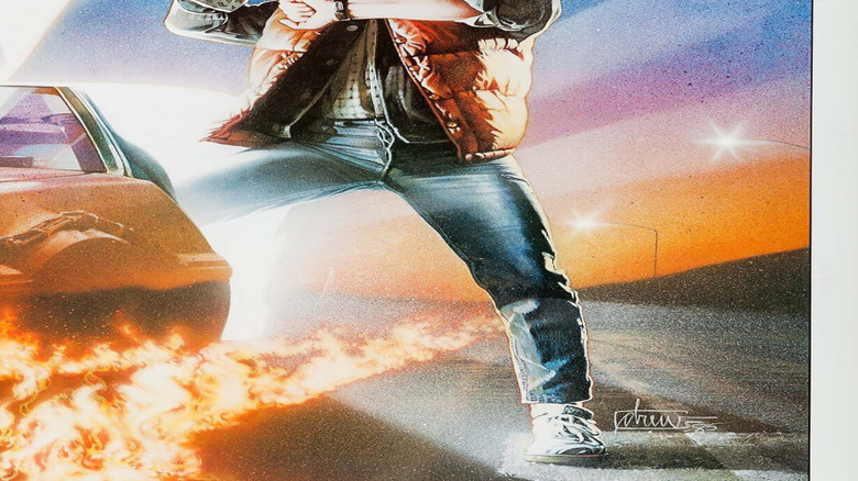 Marty McFly looking at his watch standing by the DeLorean on the poster for Back to the Future