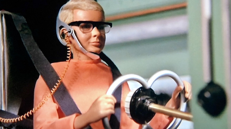 Joe McClaine driving a spy vehicle with a headet on on Joe 90