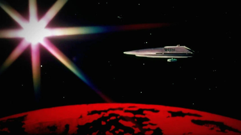 A ship flying over a red planet in John Carpenter's Dark Star