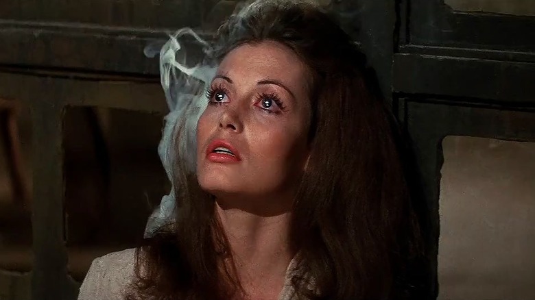 Julie Marcus as the girl in the dungeon with her head smoking in Westworld (1973)