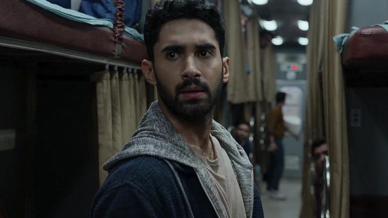 Lakshya as Captain Amrit Rathod looking concerned on a train in Kill