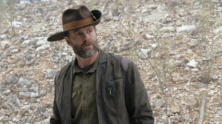 Fear the Walking Dead, Garret Dillahunt as John, walking outside in the wilderness