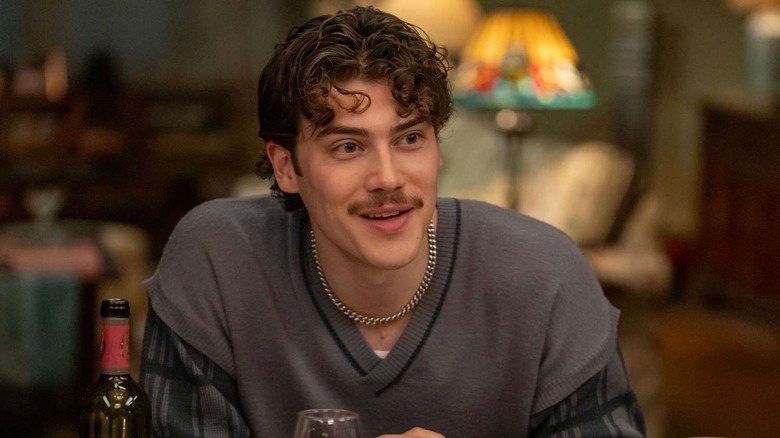 Jack Innanen as Paul Baker at a dinner table in Adults