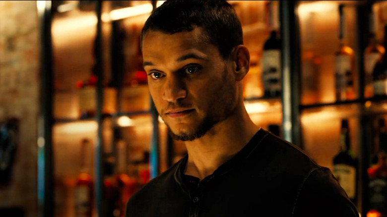 Tyriq Withers as Ledger Ward at a bar in Reminders of Him
