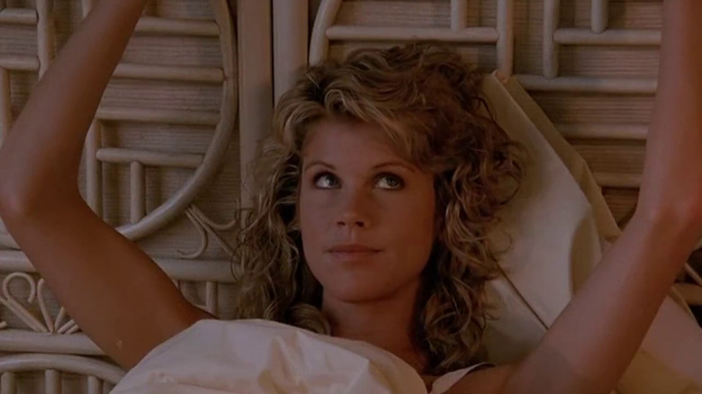 Janice Kent looking cheeky in bed in Bloodsport.