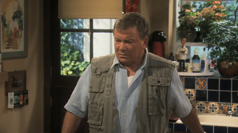 William Shatner's Dr. Edison Milford Goodson III looks confused as he stands in his kitchen in $h*! My Dad Says