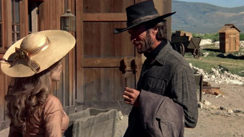The Stranger (Clint Eastwood) standing across from Callie (Mariana Hill) in "High Plains Drifter."