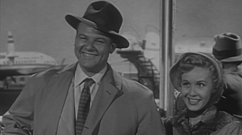 Alan Hale Jr.'s Biff Baker stands smiling beside Randy Stuart's Louise Baker in Biff Baker, U.S.A