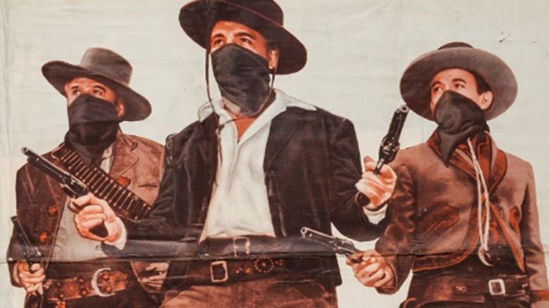 Alan Hale Jr.'s Sundance Kid, Neville Brand's Butch Cassidy and Robert Christopher's Bill Carver stand side by side on the poster for The Three Outlaws