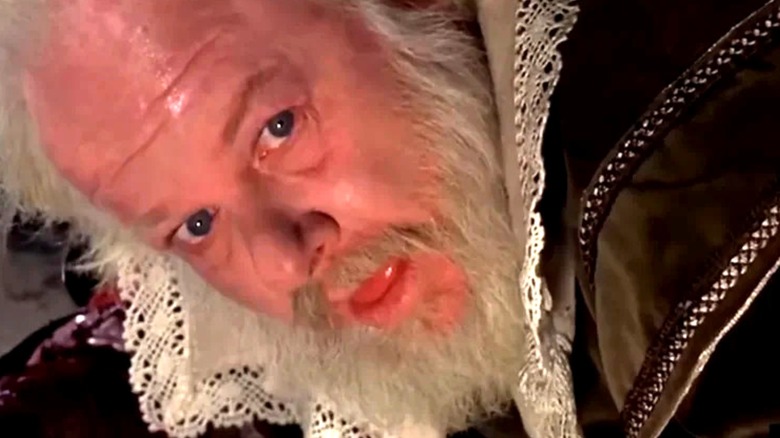 Alan hale Jr.'s Porthos looks up from the floor in closeup in The Fifth Musketeer