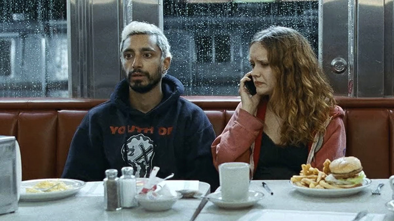 Ruben and Lou sit next to each other at a diner in Sound of Metal