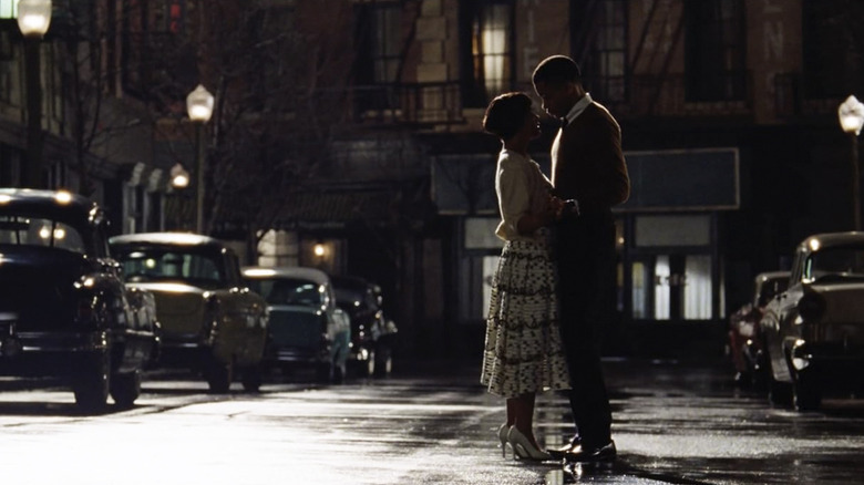 Sylvie and Robert slow-dance in the street lights of a New York City road in Sylvie's Love