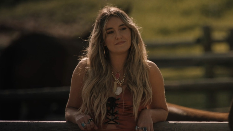 Lainey Wilson's Abby smiles as Ian Bohen's Ryan approaches in Yellowstone