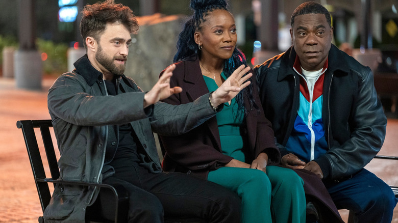 Arthur sitting on a bench with Monica and Reggie in The Fall and Rise of Reggie Dinkins